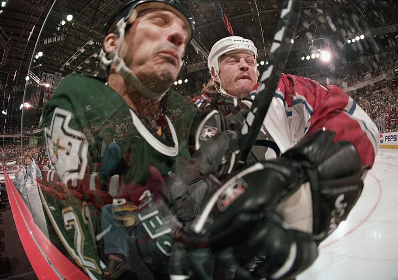 The 1999 playoff series between the Stars and Avalanche was a tough one, as evidenced by this clash between Guy Carbonneau of the Stars and Aaron Miller of the Avalanche.