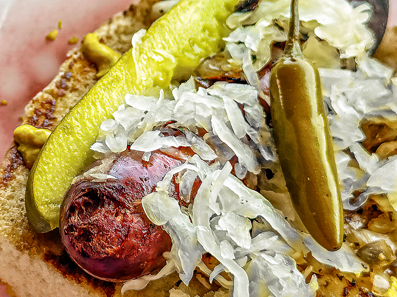Image: Jimmy's Food Store and Lee Harvey's team up to provide a Maxwell Street Polish sausage. Yes, please.