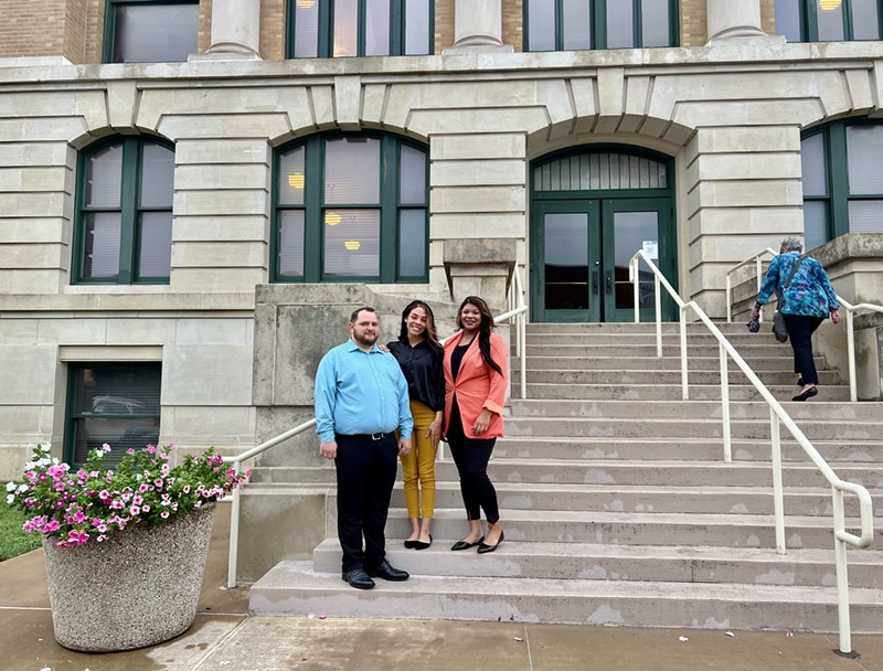 Justin Thompson, Amara Ridge and Torrey Henderson stand outside the Cooke County Courthouse during their trial in August 2022.