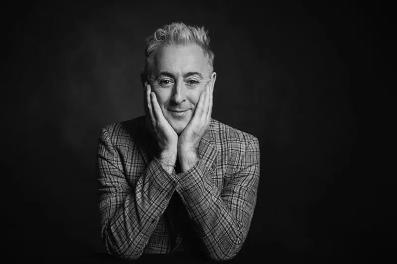 Image: A black-and-white headshot photo of Scottish actor Alan Cumming, who is bringing his quirky showmanship to Dallas' Moody Performance Hall.