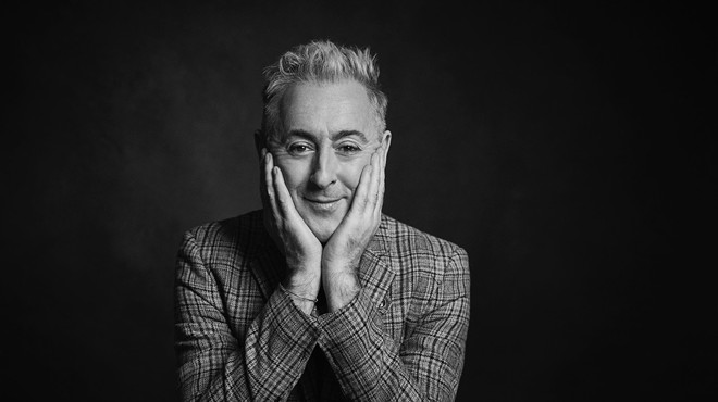 A black-and-white headshot photo of Scottish actor Alan Cumming, who is bringing his quirky showmanship to Dallas' Moody Performance Hall.