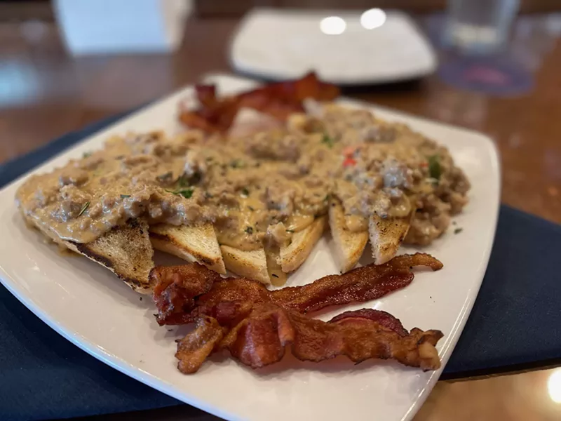 Image: That'd be toast covered in sausage gravy with a side of bacon.