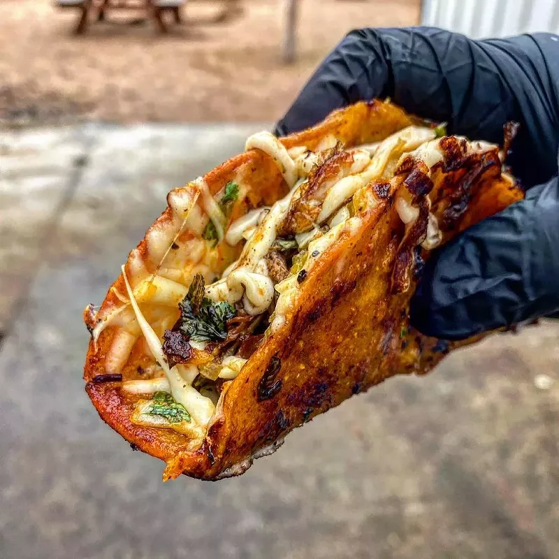 Image: You can (and should) get a birria taco with your barbecue at Hurtado.