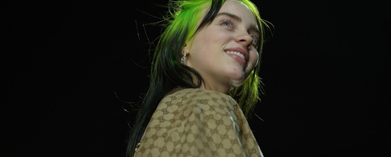 Don't let the smile fool you: Billie Eilish carries the burdens of teenage hell with a signature stare.