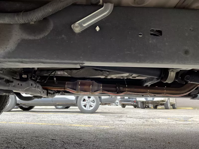 Image: The Observer editor's new catalytic converter (highlighted) with its added 'cat strap,' a ribbon of kevlar and wires intended to discourage thieves by making them work a little harder.