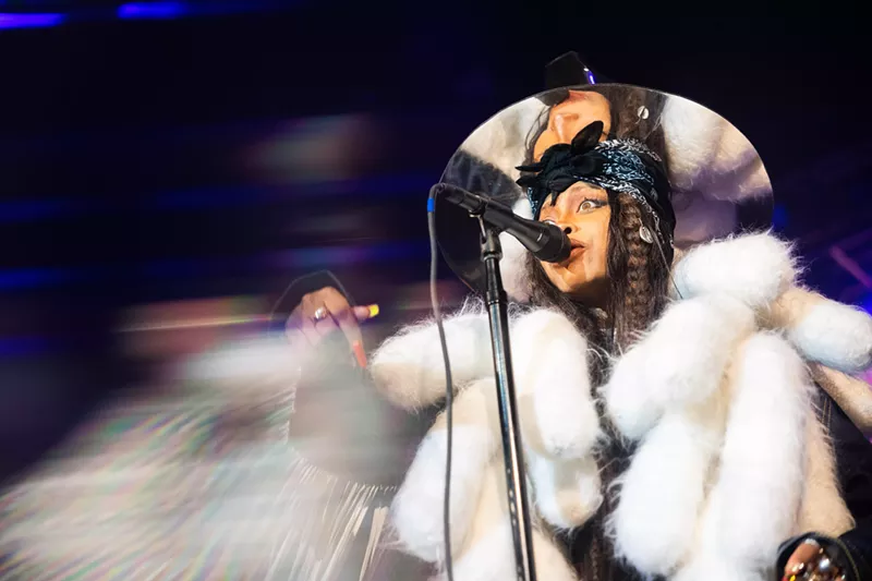 Image: Erykah Badu in a white fur coat, celebrating her birthday bash in her signature mirrored top hat back last February at The Factory.