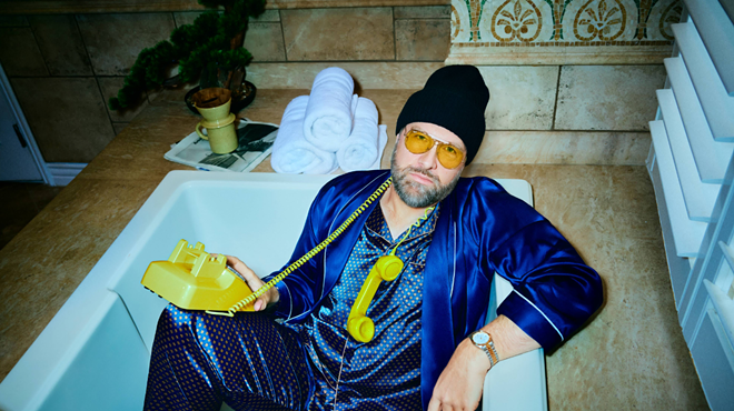 Man in tub with yellow phone