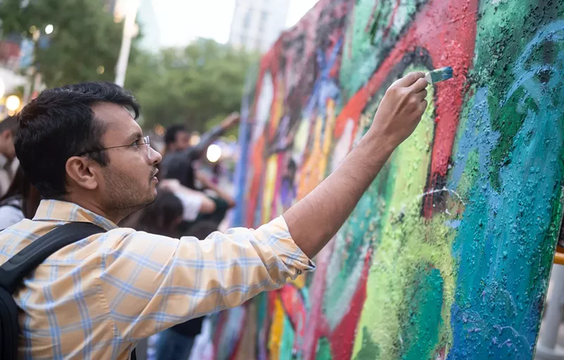 Image: Guests of this year's Dallas Arts District annual Block Party got the chance to contribute to a new community mural.