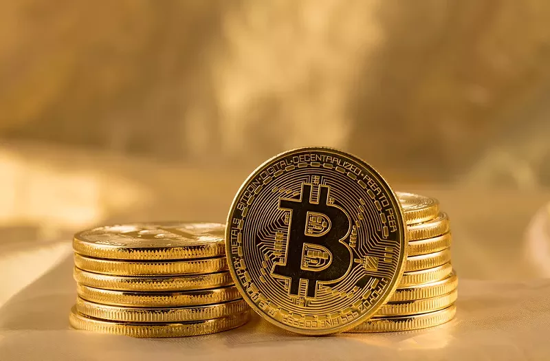 Image: A Dallas-based company lured investors into a fake cryptocurrency scheme by promising a path to wealth for "those individuals who missed out on bitcoin."
