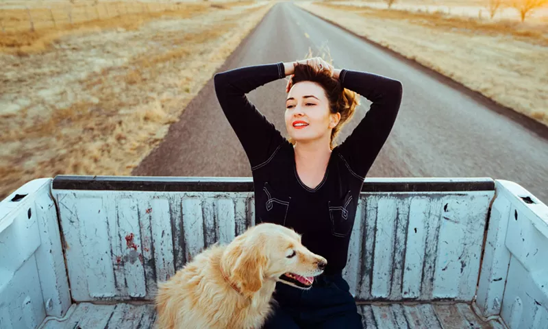 Image: Singer-songwriter Jess Williamson poses with Nana, the rescue dog she found on the road in New Mexico a little over two years ago during one of her marathon trips.