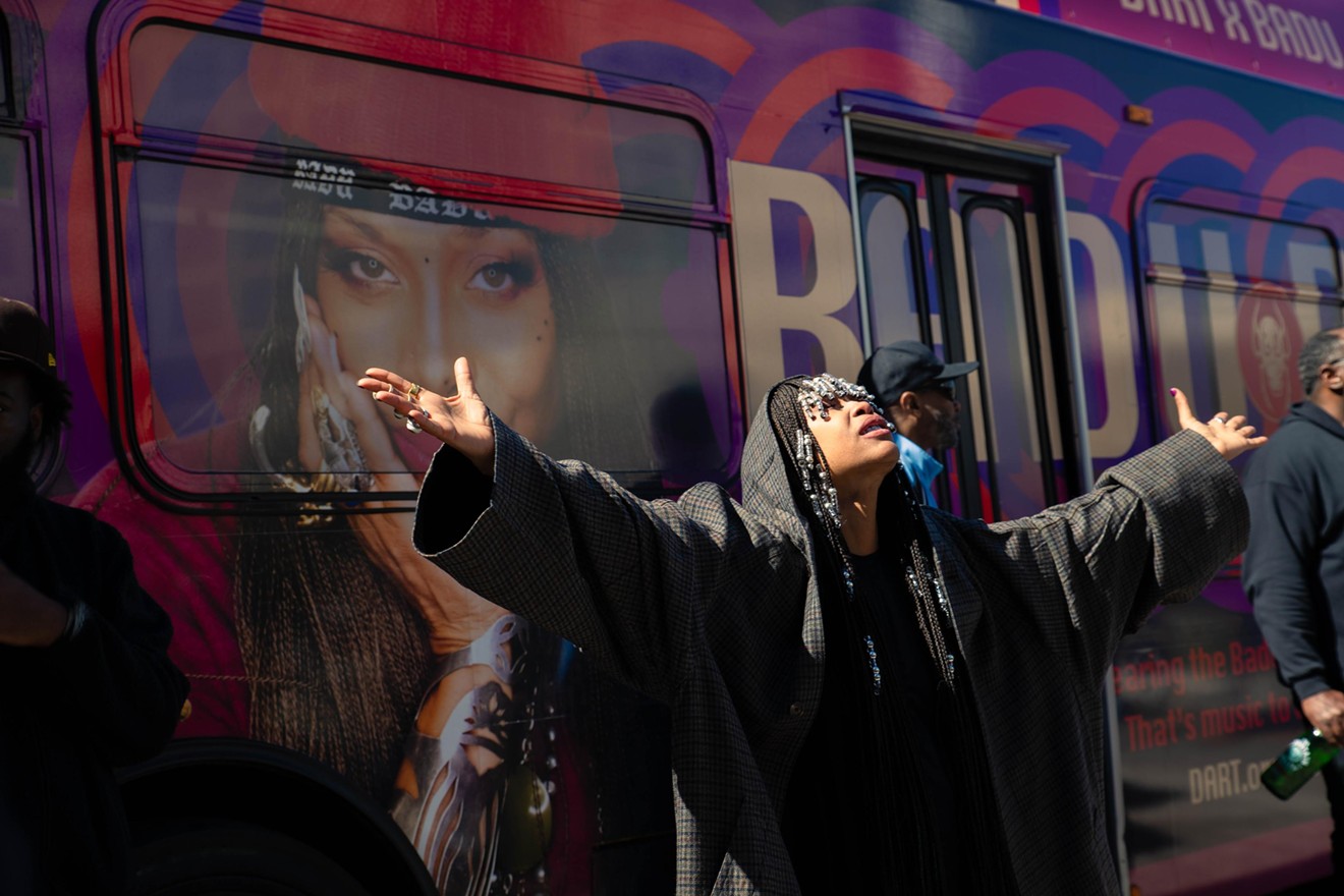Erykah Badu poses for the press in front of her very own Badu Bus, an initiative by DART to honor the Dallas singer.