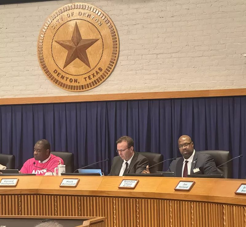 Image: Mayor Gerard Hudspeth, left, voted in favor of repealing Denton's low-level marijuana decriminalization ordinance. Mack Reinwand, center, the city's attorney, recommended the city repeal the ordinance. Councilmember Brandon Chase McGee, right, voted against repealing the ordinance.