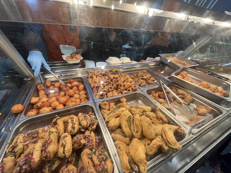 Image: Indulge in any of the hundreds of varieties of fried Indian snacks that stock the Chowrastha cases.