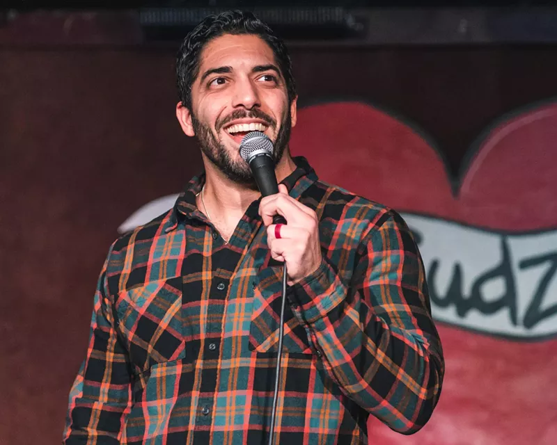 Image: Shayhan Jahani performs on the mic. He is one of Dallas' best comedians to watch this year.
