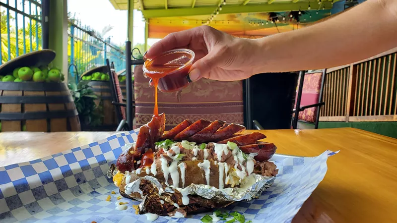 Image: the loaded baked potato from Sosa BBQ