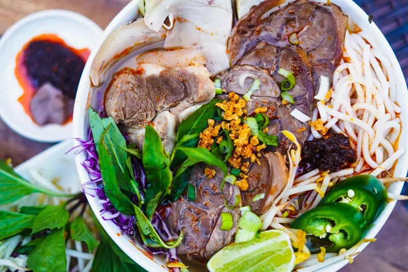 Image: Bún bò huế is a noodle soup with pork sausage, sliced beef shank, pork knuckle, sliced pork and blood cake.