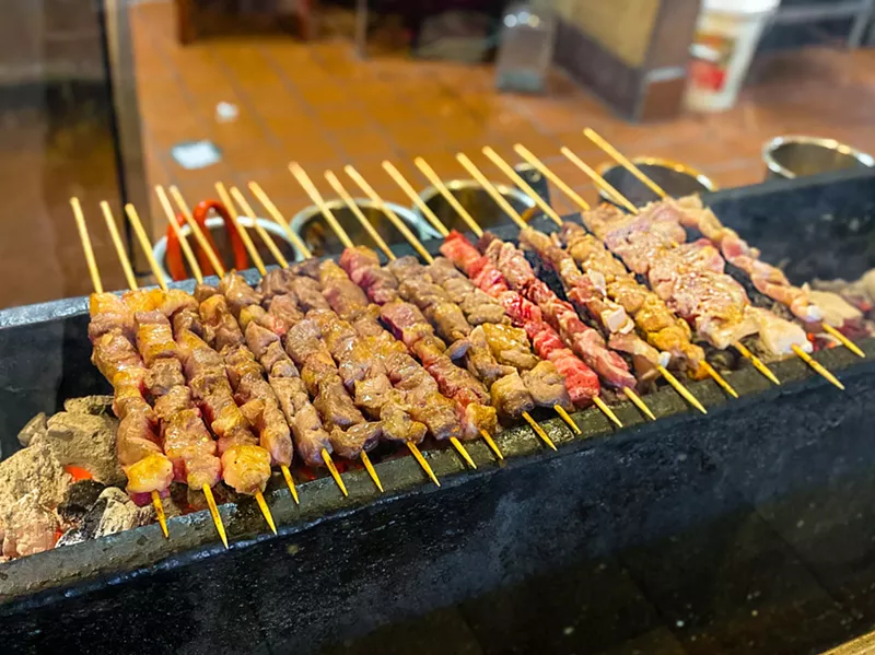 Image: Skewers of meats and veggies get the grill treatment front and center at Fat Ni BBQ