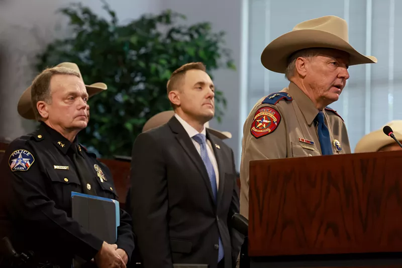 Image: Texas Department of Public Safety Regional Director Hank Sibley speaks as Allen Police Chief Brian Harvey (left) and FBI Special Agent in Charge Chad Yarbrough listen during a press conference at Allen City Hall.