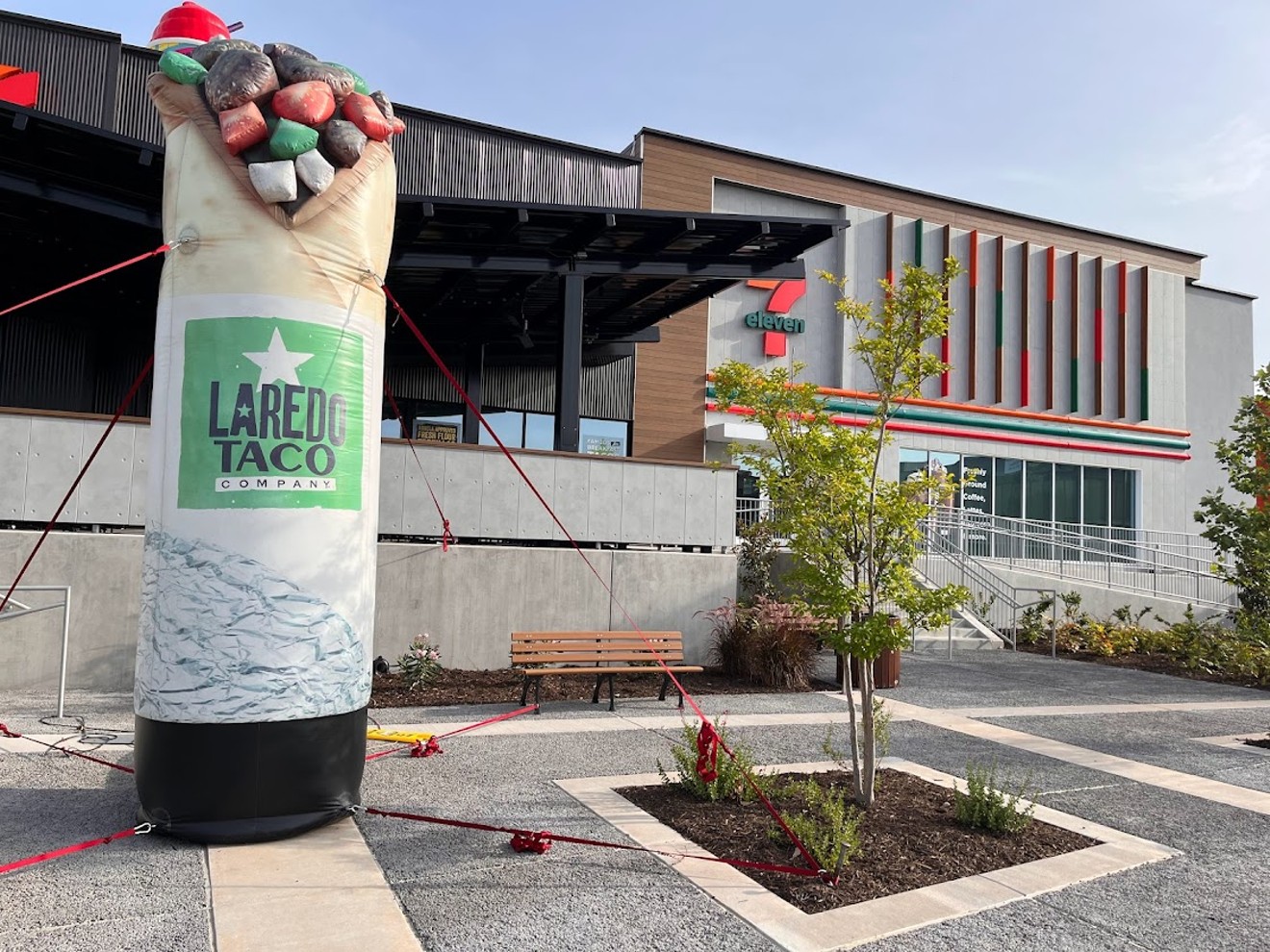 A big, inflatable burrito greets guests of the new 7-11 concept at the corner Preston and Alpha Road that houses the Laredo Taco Company restaurant.