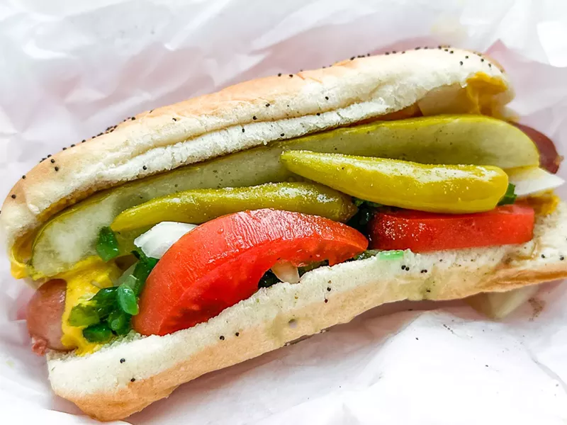 Image: A Chicago-style hot dog: Vienna beef hot dog with tomato, mustard, pickle, relish, sport peppers and chopped onion, all in a poppy seed bun sprinkled with celery salt. Nailed it. (There is a hot dog in there somewhere...)