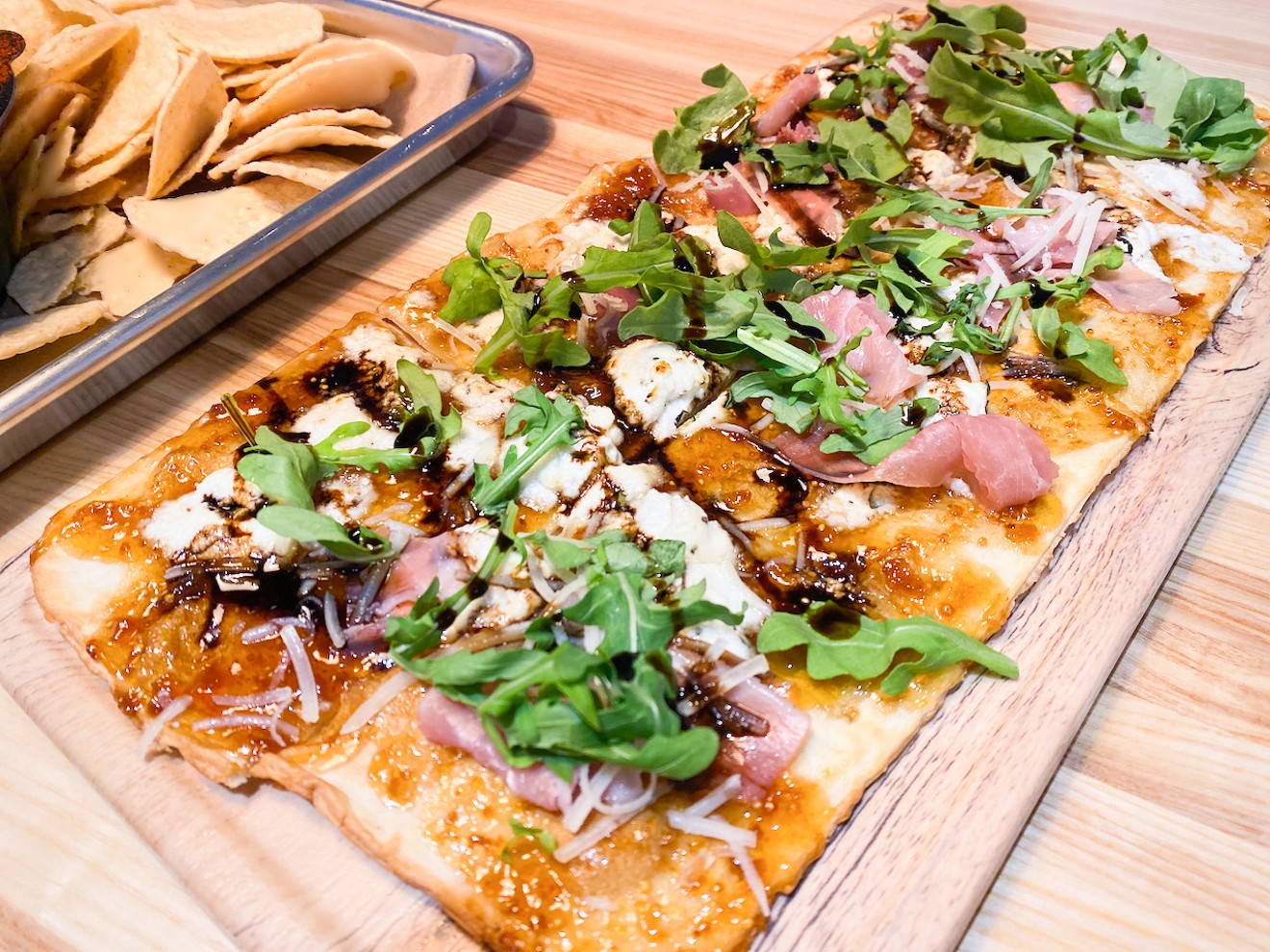 There are four different flatbreads on offer, including this one topped with prosciutto, fig preserves, arugula and a Temptress reduction.