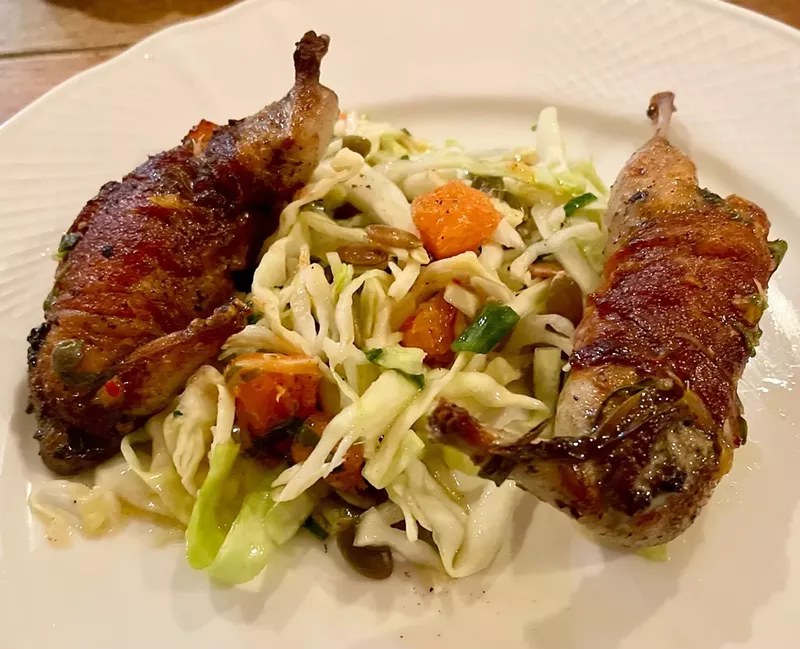 Image: The plancha-cooked quail is wrapped in Jamon Serrano.