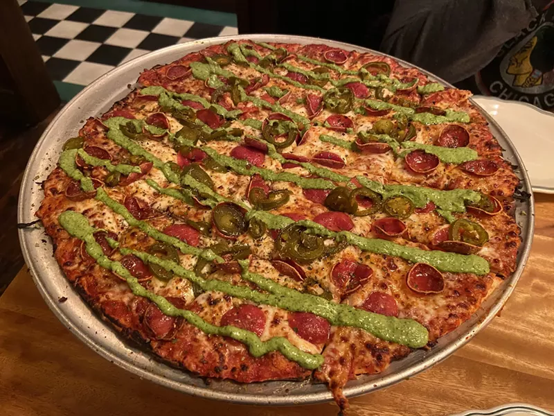 Image: Tavern-style pizza at DL Macks is thin, but doesn't have the requisite crispiness.
