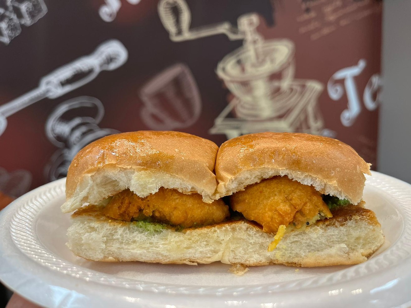 Vada Pav is a classic Indian street sandwich, stuffed with balls of fried potato and spicy chutney.