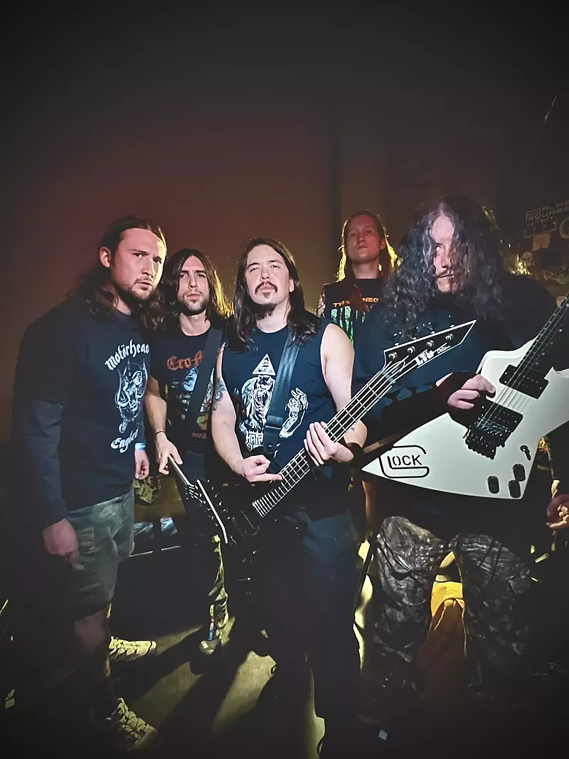 Image: A band posing for a photo