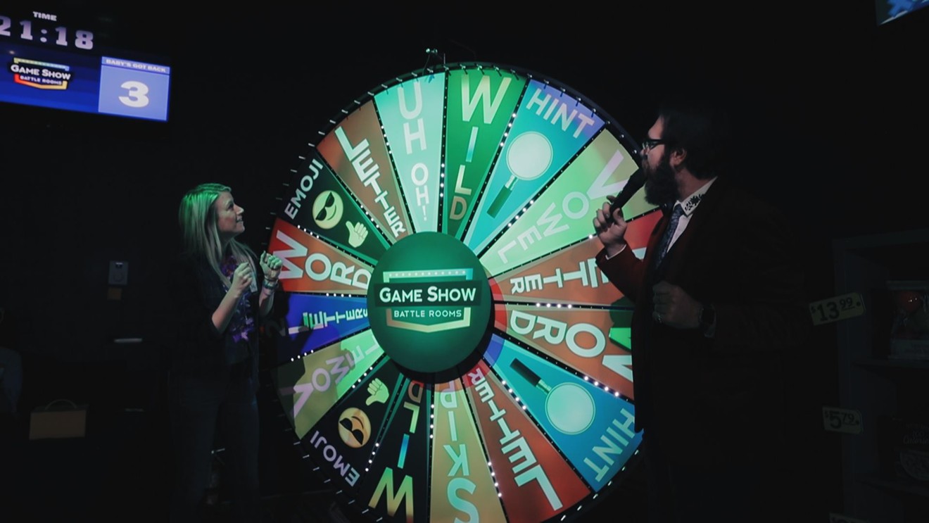 A contestant spins the big wheel during a round of Spin & Solve, one of six games produced by the live entertainment experience Game Show Battle Rooms in Farmers Branch.