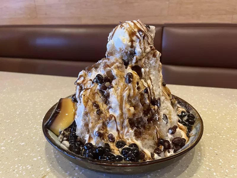 Image: Shaved ice drenched in black sugar syrup and condensed milk, and topped with tapioca balls and sweetened red beans and vanilla ice cream.