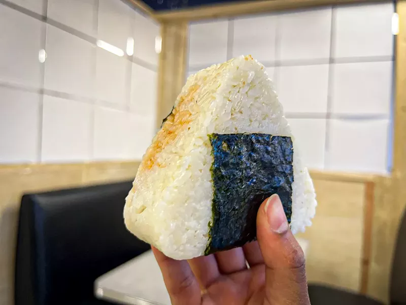 Image: Onigiri is a typical Japanese snack, coated in sticky white rice and wrapped in seaweed.