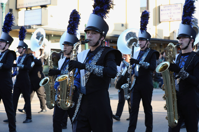 Image: Band members walking down a street