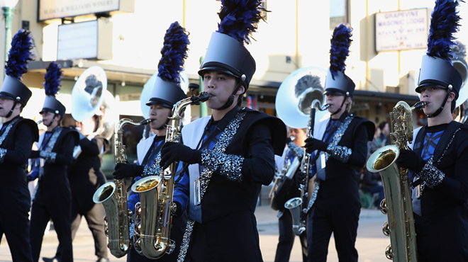 Band members walking down a street