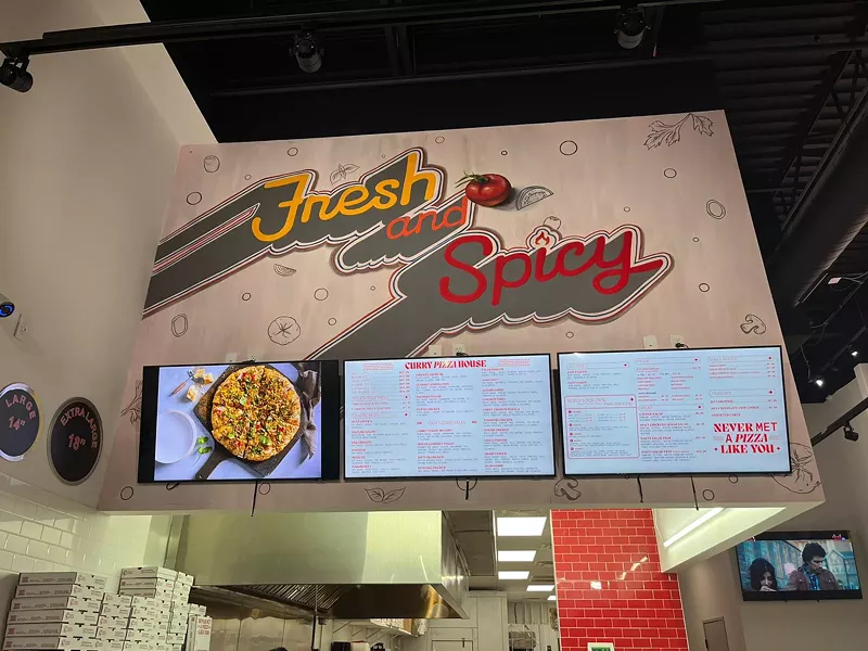 Image: The inside of the new pizza joint reads Fresh and Spicy in bold letters. They're not wrong.