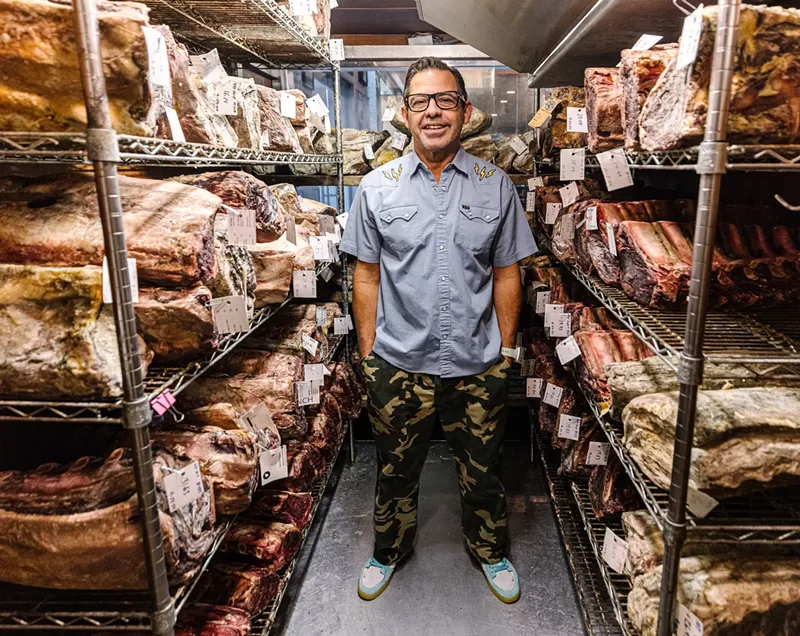 Image: Knife owner John Tesar stands in his meat locker filled with 44 Farms beef.