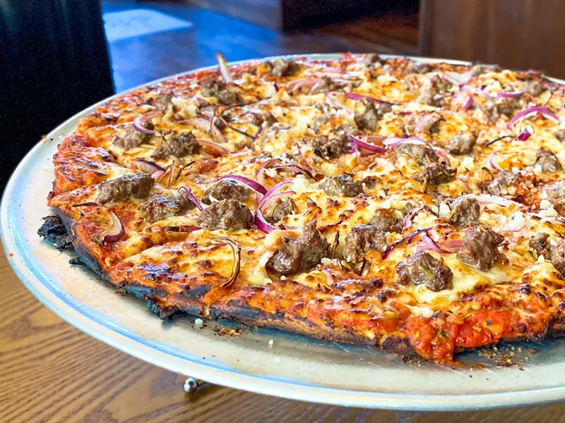 Image: Thin crust tavern-style pizza at DL Mack's. We hope the robot approves.