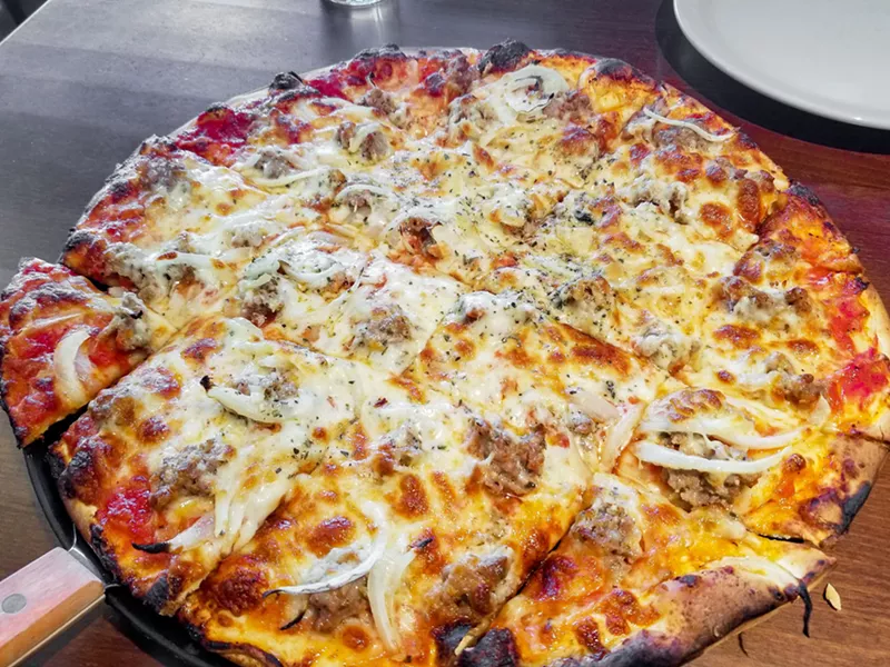 Image: Italian sausage and onion pizza, Rosati's version of Chicago tavern-style thin crust.