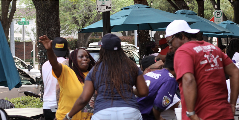 Image: Shalonda Gilmore, left, hugs someone who turned out to remember her son Kealon who was shot and killed at a recent party in southern Dallas.
