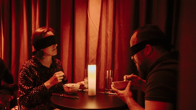 Diners at Dining in the Dark have blind folds over their eyes.