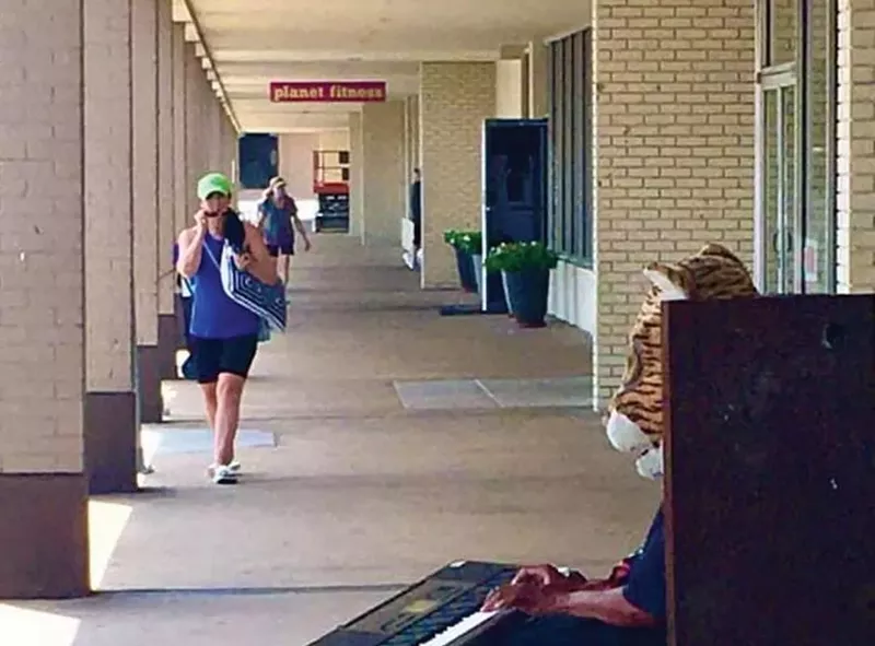 Image: Tiger Head Keyboard Dude making his keyboard roar at a shopping strip in Denton.