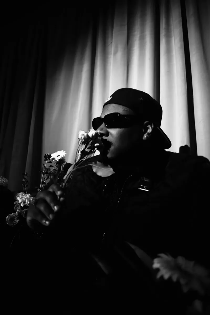 Image: Man smelling flowers