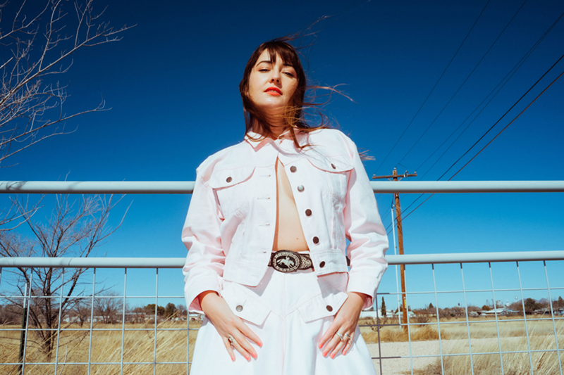 Image: Woman in front of ranch