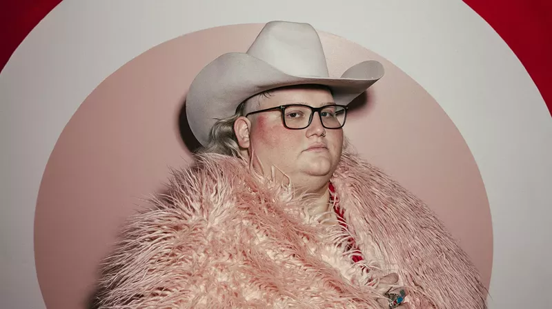 Image: Joshua Ray Walker, seen in a pink furry coat and white hat, opened up about his recent medical scares, including a cancer diagnosis, for which he's currently undergoing chemo.