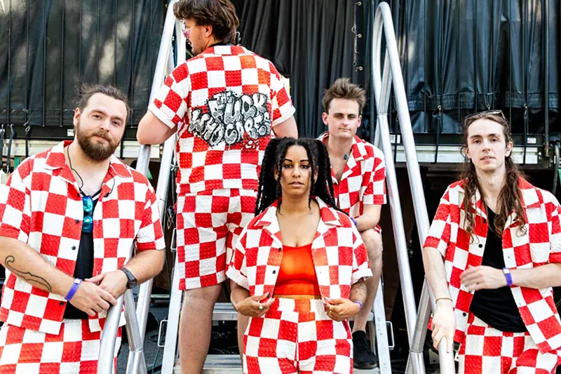Image: Photo of band posing for a picture