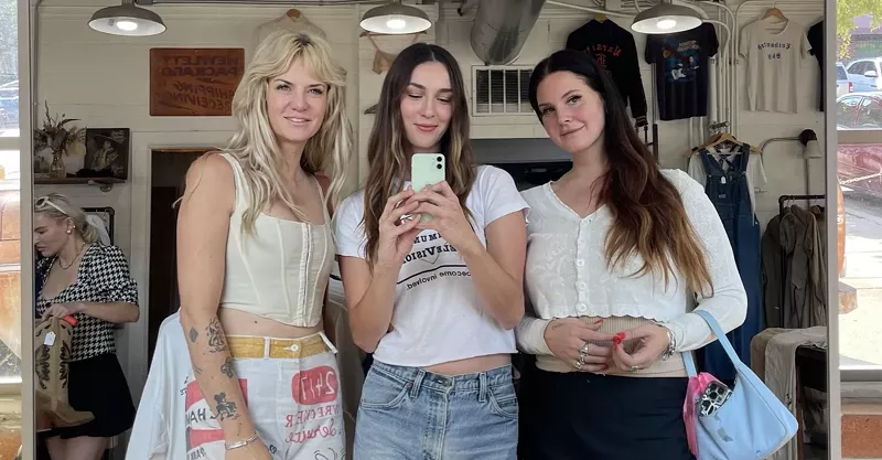 Image: Country singer Nikki Lane (left), Rare Heart Vintage owner Katie Randle (middle) and singer Lana Del Rey pose for a selfie Tuesday at Randle's store in Bishop Arts.