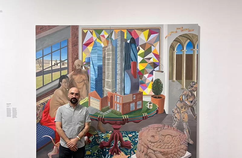 Image: Artist Francisco Moreno with the history painting “A city in a house in a room” at Soy de Tejas in Arts Fort Worth.