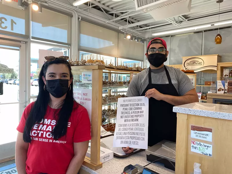 Image: Moms Demand Action volunteers are equipping business owners with signs prohibiting firearms.