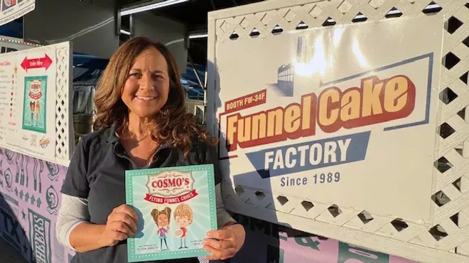 Author Allyson Jannotta holds her first published book, children's story Cosmo’s Flying Funnel Cakes.