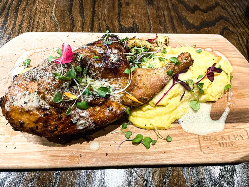 Image: Roasted half chicken over buttery whipped corn potatoes.